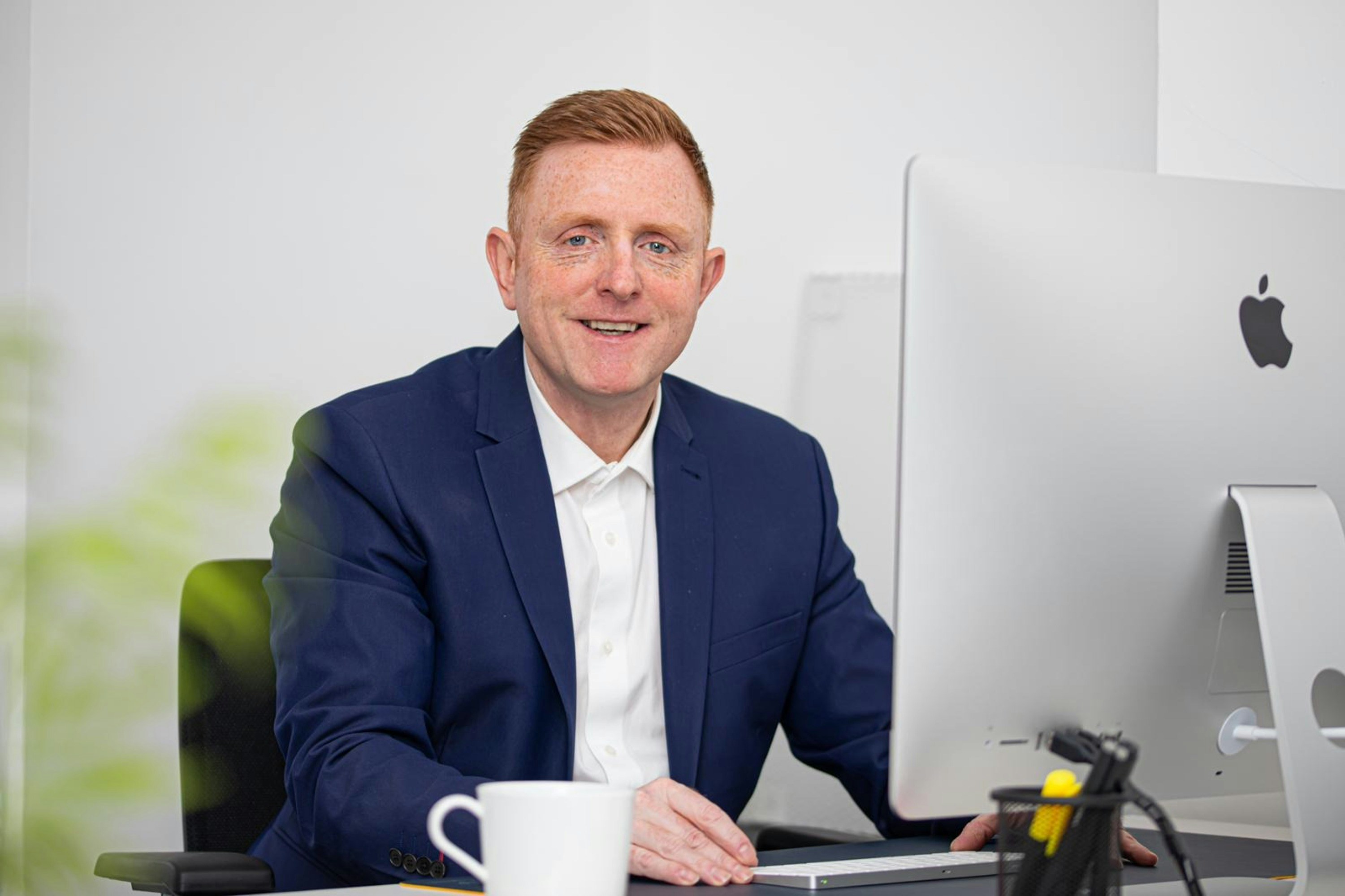 Persona portrait of Henrik, SaaS founder reviewing remote team